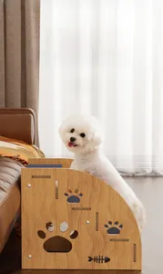Detail of wooden pet ramp with non-slip surface and decorative paw cutouts for dogs