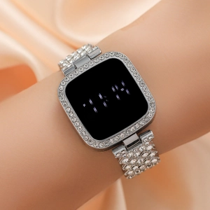 Elegant square silver digital watch with rhinestone crystals and LED display on a wrist