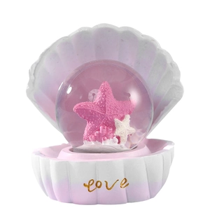 Seashell crystal ball with pink starfish and gold love base for ocean desktop decor