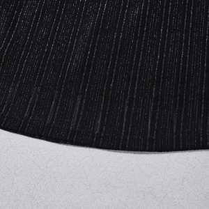 Detail of black ribbed fabric with silver metallic threads and textured vertical stripes