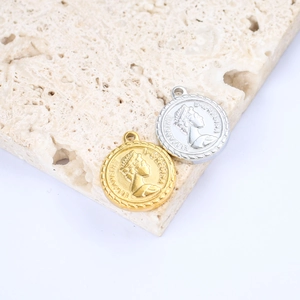 Detailed close-up of Queen Elizabeth II relief on gold and silver round steel pendants