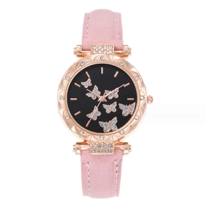 Women's pink suede quartz watch with gold case and rhinestone butterfly pattern on black dial
