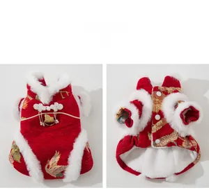 Detail of red pet tang suit featuring gold crane embroidery and white faux fur trim