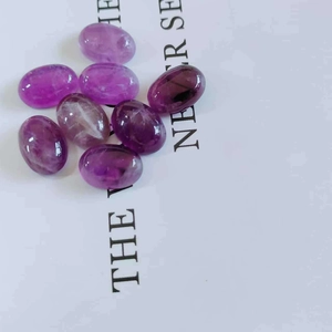 Macro shot of oval purple natural amethyst gemstones for DIY jewelry settings