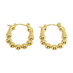 Polished gold beaded hoop earrings in minimalist French style for a chic look