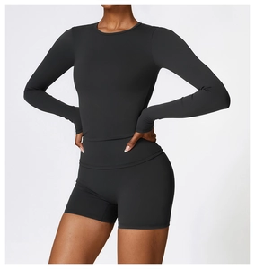 Close-up of black long-sleeved fitness top and shorts with ergonomic seamless tailoring