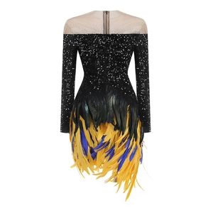 Detail of sequin evening dress featuring back zipper and layered colorful feathers