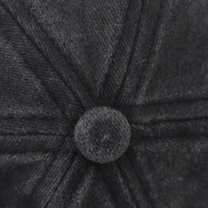 Close-up of the black washed baseball cap top with button detail and reinforced stitching