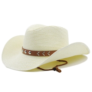 Close-up of woven straw cowboy hat with brown leather band and metal V-shaped ornaments