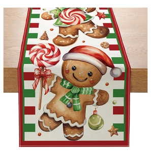 Close-up of Christmas table runner with gingerbread man and candy cane patterns on wood