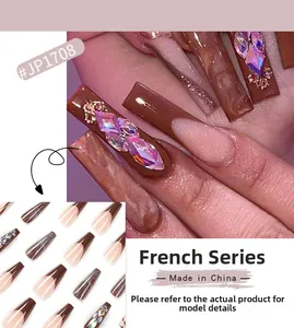 Detail of French Series long coffin nails with brown marble patterns and 3D crystals