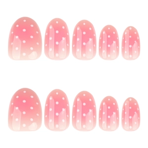 Short oval press-on nails with pink ombre gradient and white polka dot pattern