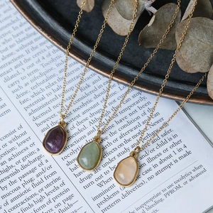 Irregular green aventurine and purple teardrop necklaces in 18K gold plated titanium
