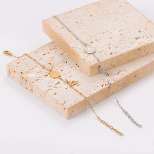 Vintage stainless steel bracelets with oval medal and cross charms in gold and silver finish