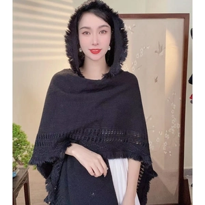 Elegant black hooded knitted shawl with fringe details and hollow pattern for travel