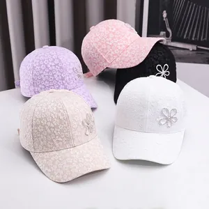 Lace baseball caps with floral embroidery and rhinestones in pink, purple, and white colors