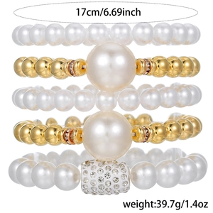 Five-piece stackable faux pearl bracelet set with gold beads and sparkling rhinestones