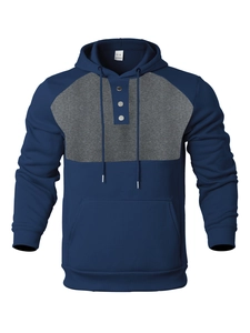 Detailed view of navy blue and grey hoodie featuring a three-button neckline and soft texture