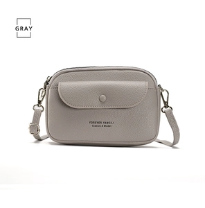 Gray lychee grain leather crossbody phone bag with zipper top and silver hardware details