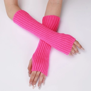 Detail of hot pink ribbed knit arm warmer with fingerless thumb hole design