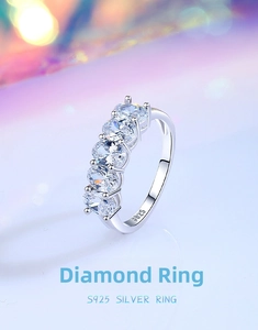 Detail of S925 sterling silver ring with five oval-cut claw-set sparkling stones
