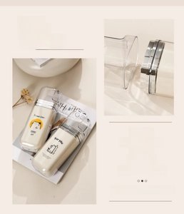 Close-up of portable travel bottles with cute cartoon patterns and silver-edged lids