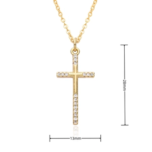 Detailed view of a gold cross pendant measuring 28mm by 13mm with white stones