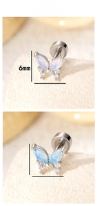 Detailed macro view showing the 6mm by 7.8mm butterfly stud earrings with zircon inlay