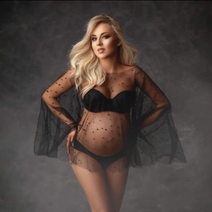 Elegant black maternity photography dress featuring sheer mesh with pearl embellishments