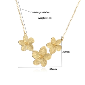 Detailed view of golden flower pendant necklace with dimensions and chain length
