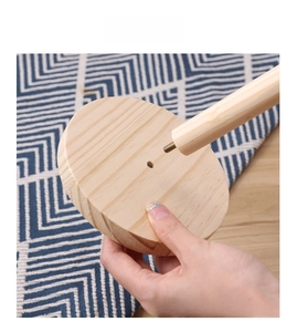 Detailed view of the screw-in assembly for the wooden paper towel holder base and rod