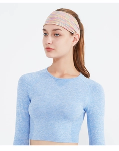 Close-up of elastic striped sports headband worn by a model for yoga and running