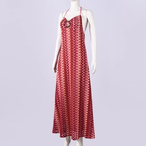 Close-up of knit halter maxi dress featuring colorful wave patterns and a metal ring