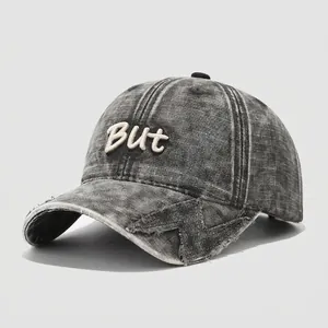 Kids vintage washed cotton baseball cap with embroidered But lettering and distressed brim