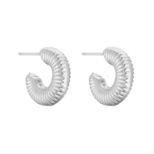 Detailed view of silver-tone C-shape hoop earrings with spiral textured pattern