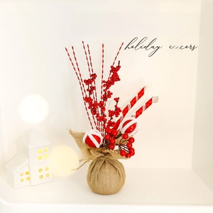 Christmas burlap base decor with red berries and festive stripes on white background
