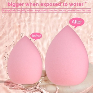 Macro view showing pink makeup sponge expanding significantly after contact with water