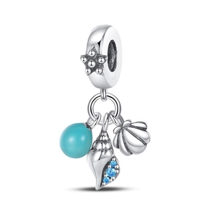 Close-up of ocean-themed silver charm with starfish, blue conch, and turquoise bead