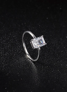 Macro shot of silver ring featuring a rectangular cut zircon with professional lighting