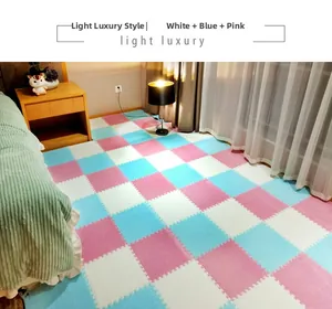 Detail view of interlocking plush puzzle floor mats in white, blue, and pink colors