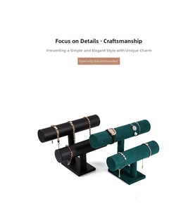 Detail view of double-tier velvet and leather T-bar jewelry stands for watches and bracelets