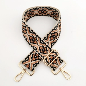 Close-up of bohemian jacquard wide bag strap with durable gold metal swivel hooks