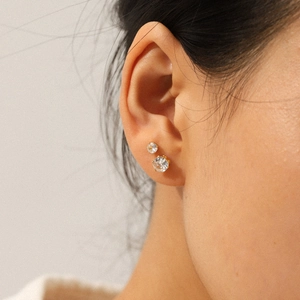 Golden stainless steel stud earrings with clear round cubic zirconia set in prongs