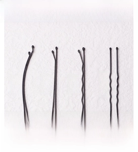 Detail view of black metal hair clips in curved, flat, wavy, and U-shaped styles