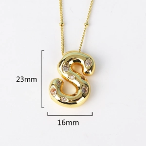 Detail view of a gold S-letter pendant showing dimensions of 23mm height and 16mm width