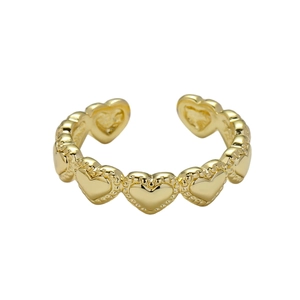 Golden heart-shaped open ring with intricate beaded texture and adjustable design
