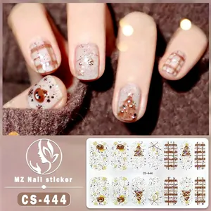Detailed Christmas nail sticker view with brown bear, tree, and snowflake patterns