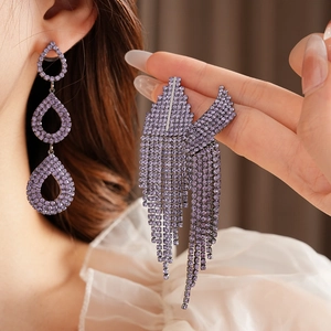 Exquisite long purple rhinestone earrings with elegant fan-shaped fringe tassels on model