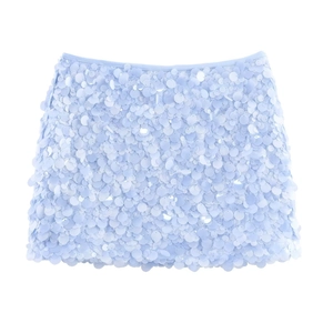 Detailed view of light blue sequined mini skirt with reflective circular sequins texture