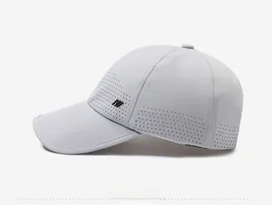 Detail of grey quick-dry baseball cap featuring laser-cut ventilation holes and side logo